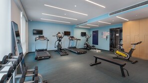 A gym with treadmills, stationary bikes, and dumbbells. - Holiday Inn Express Kunming West by IHG (Kunming)