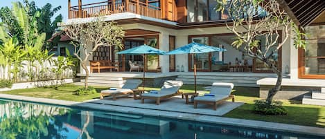 An infinity pool, pool loungers