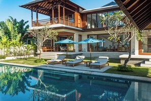 An infinity pool, pool loungers