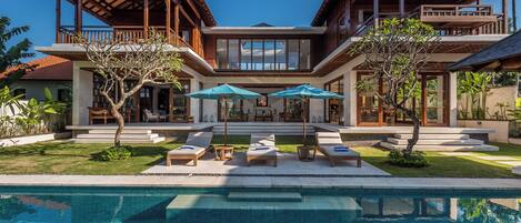 An infinity pool, pool loungers