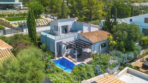 A modern villa with a pool, surrounded by lush greenery and mountains. - Amanecer by Interhome (Alcúdia)