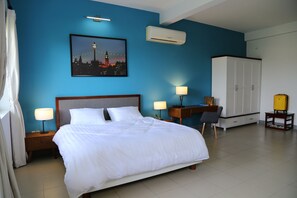 Minibar, desk, blackout curtains, iron/ironing board