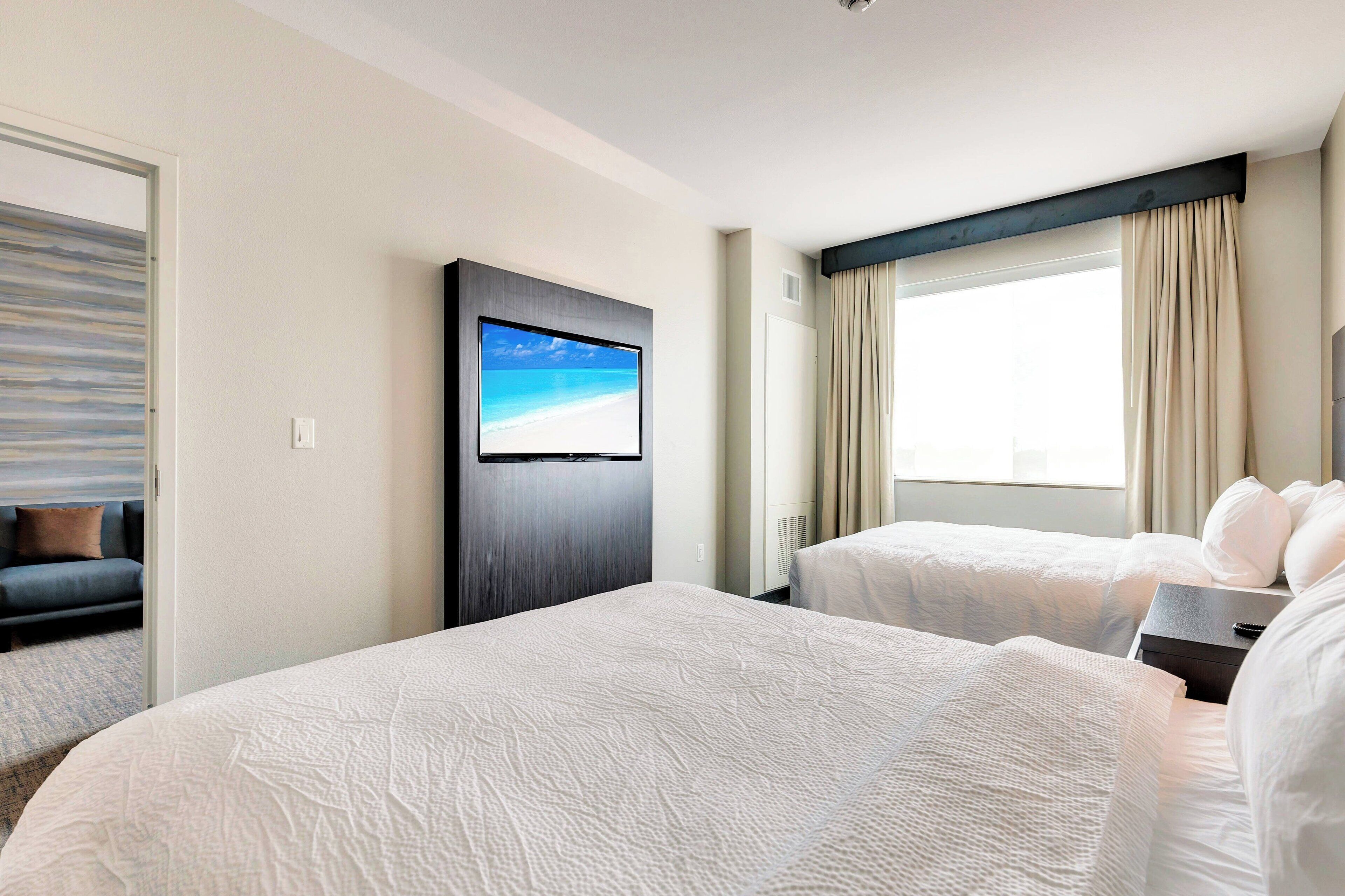 premium bedding, down duvets, memory-foam beds, desk