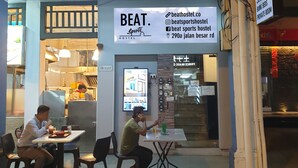 A hostel named 'BEAT Sports Hostel' with a reception area, dining area, and a private room. - BEAT. Sports Hostel (Singapore)