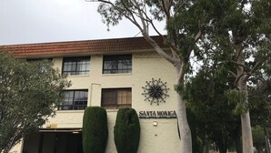 A building with a sign reading "Santa Monica." - Santa Monica apartment (Carnegie)