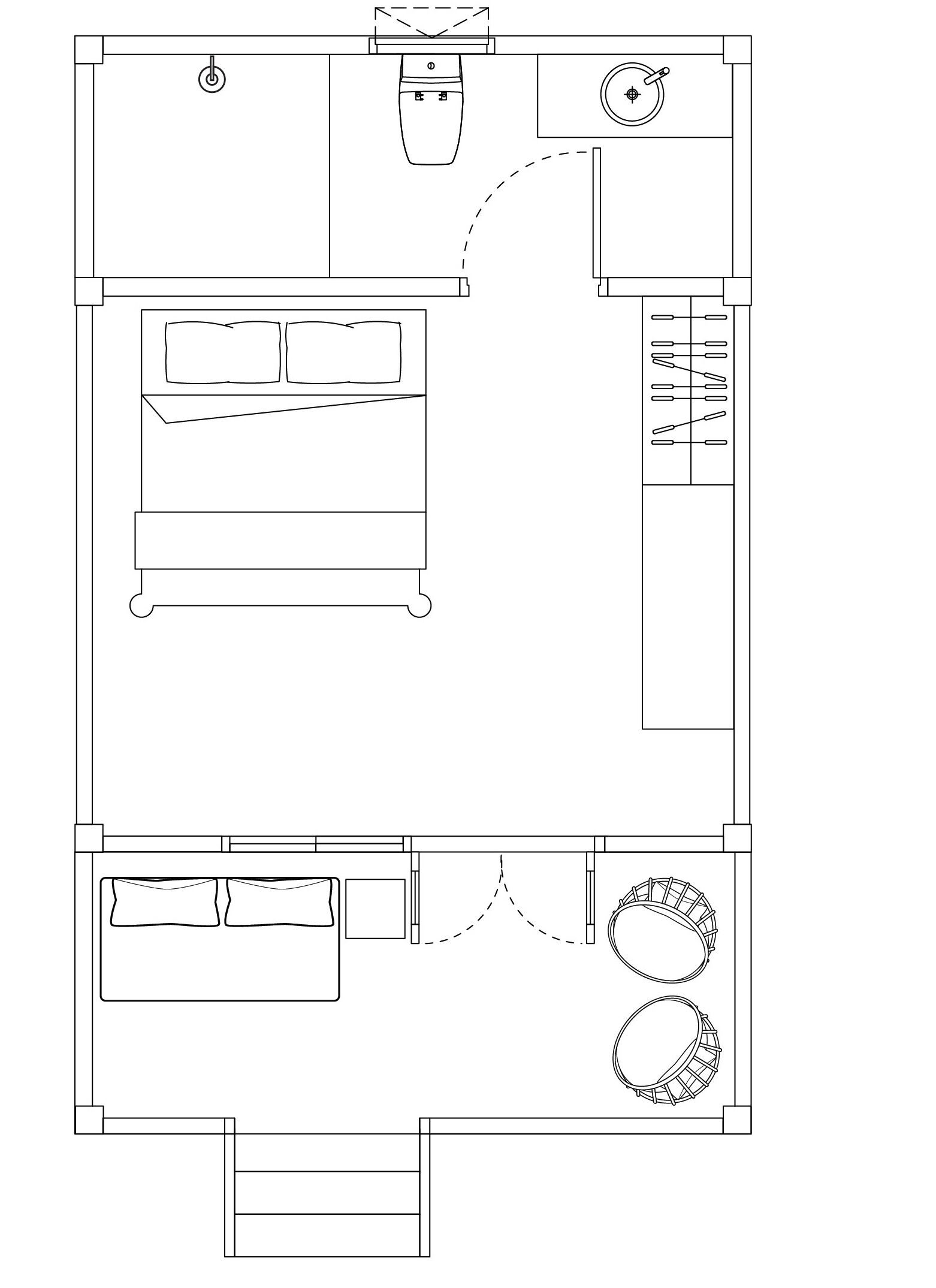 Plano de planta de una habitación de hotel con cama, escritorio, silla, una mesita y una zona de estar circular.
