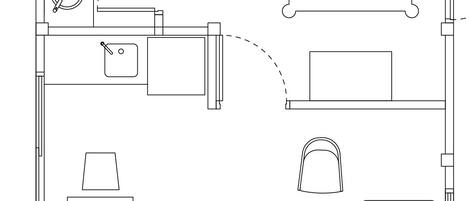 Disposizione di una camera d'albergo con un letto, una scrivania, una sedia e un tavolino.