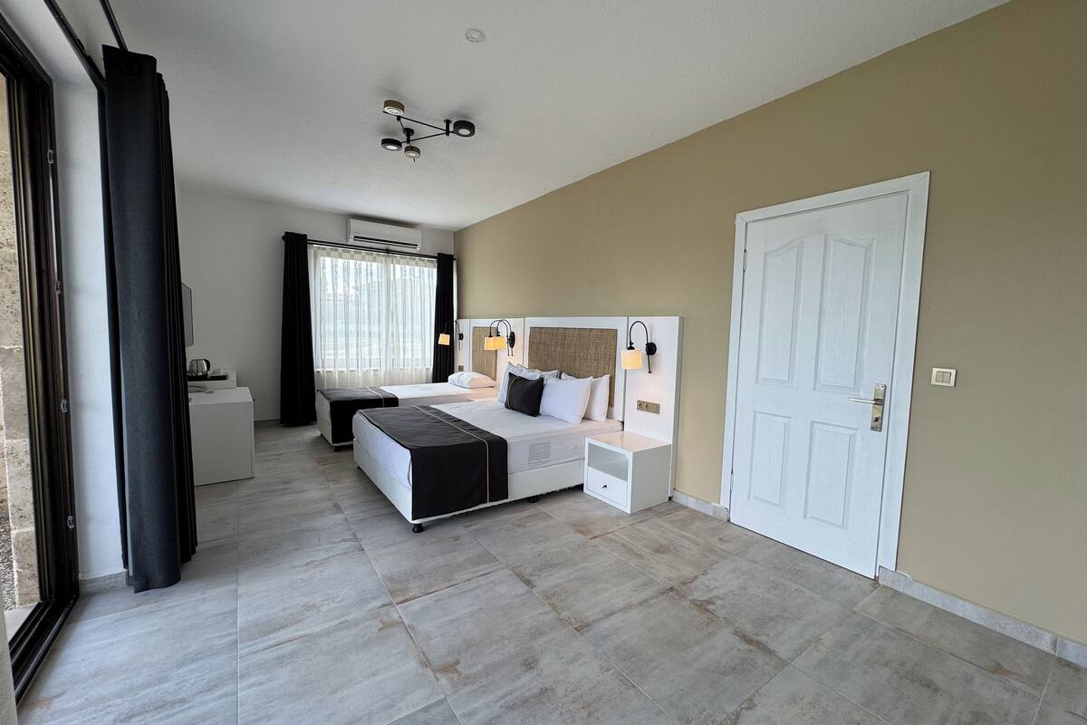 family room | premium bedding, minibar, in-room safe, blackout curtains