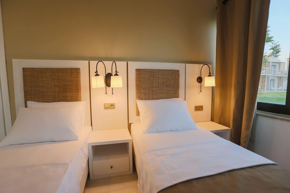 family room | premium bedding, minibar, in-room safe, blackout curtains