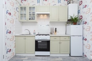 Apartment | Private kitchen | Fridge, stovetop, electric kettle, cookware/dishes/utensils - Apartment Diana (Odesa)