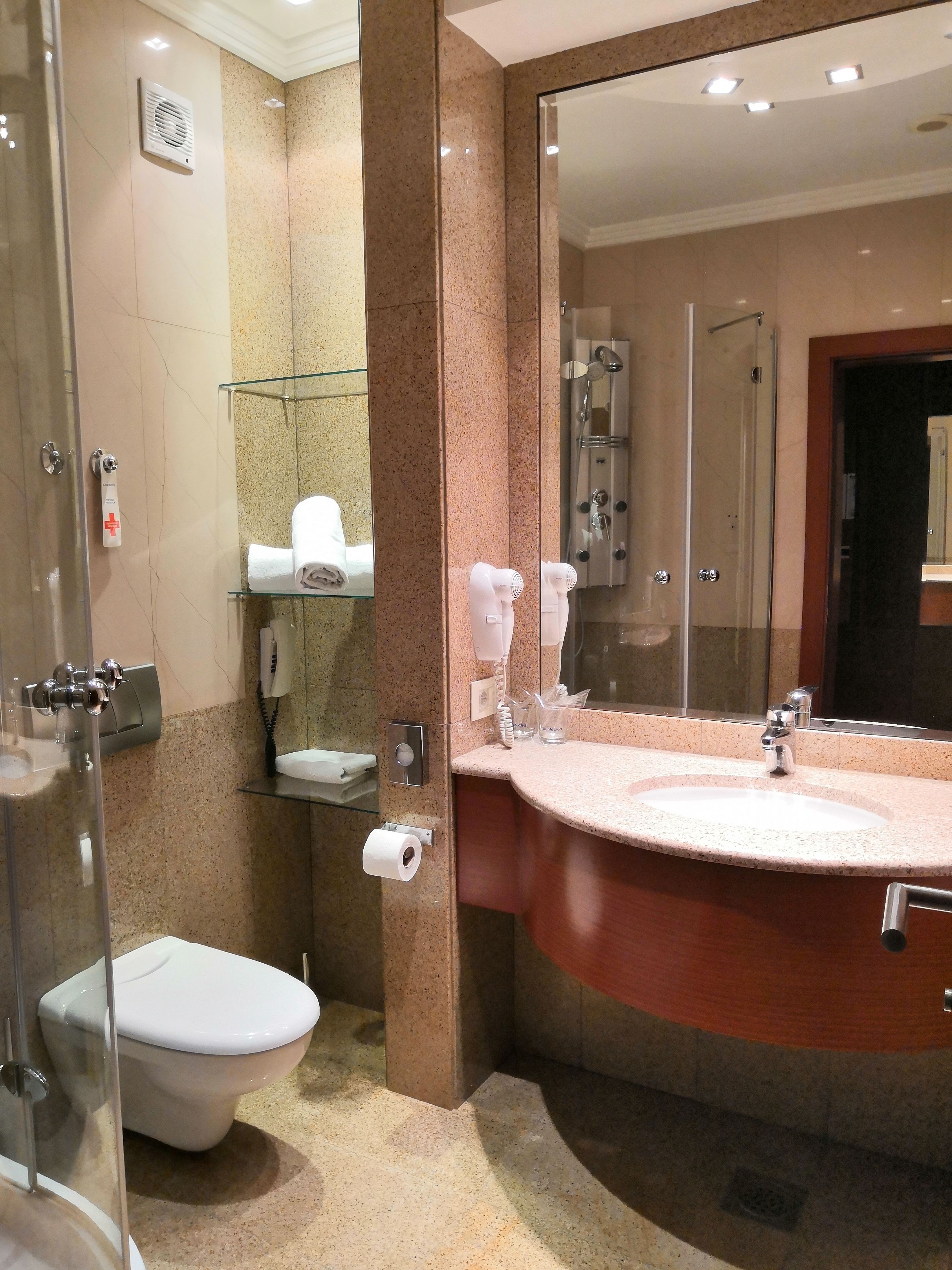 junior suite | bathroom | shower, free toiletries, hair dryer, towels