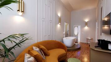 Deluxe Suite, Bathtub | Living room | Flat-screen TV, Netflix
