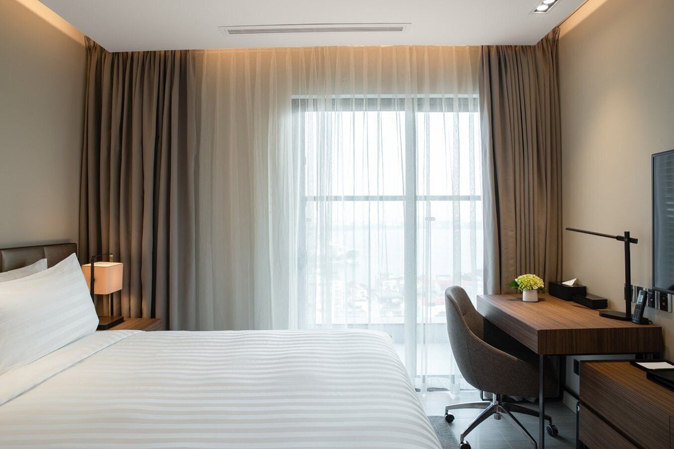 Premium bedding, down comforters, free minibar items, in-room safe