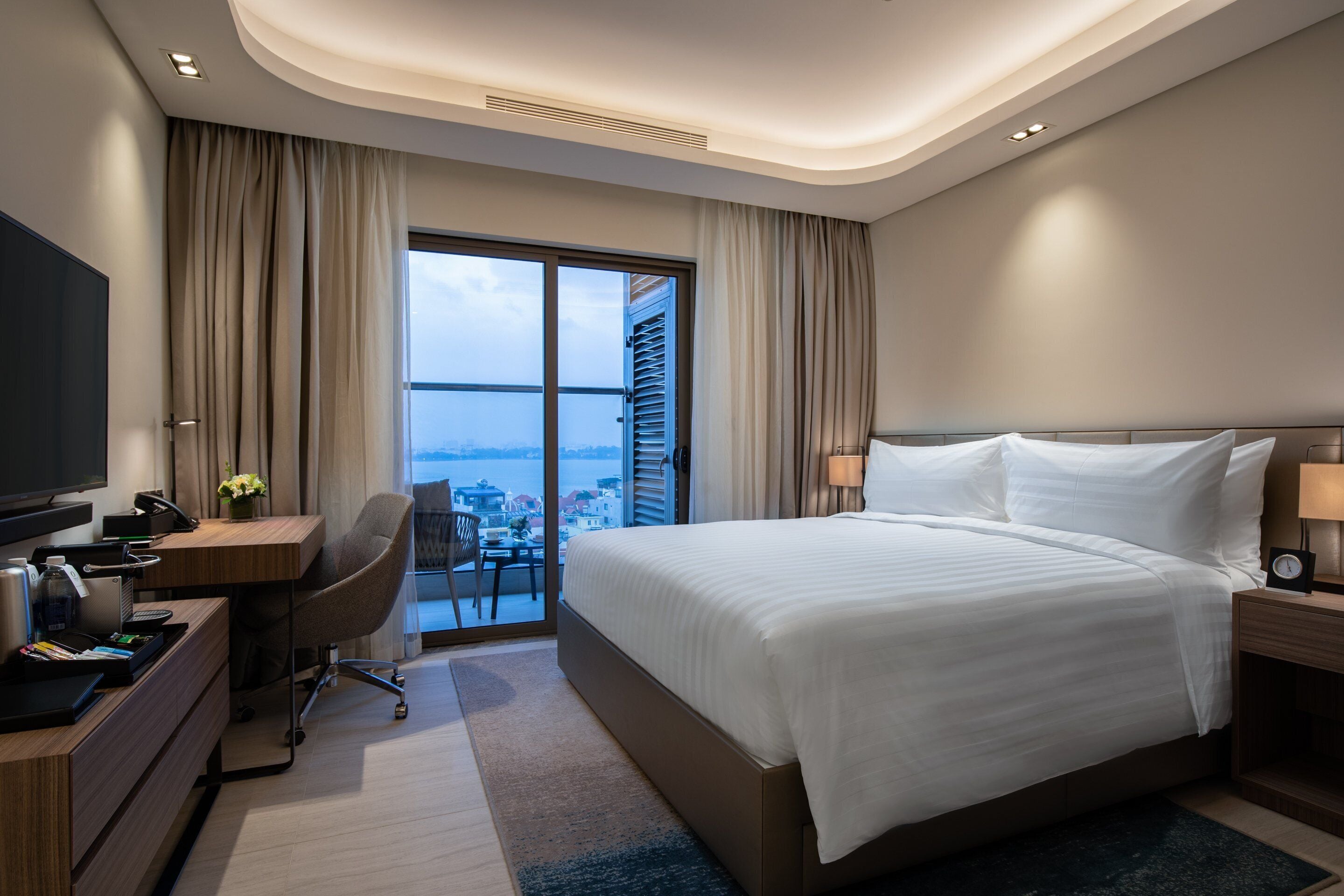 Premium bedding, down comforters, free minibar items, in-room safe