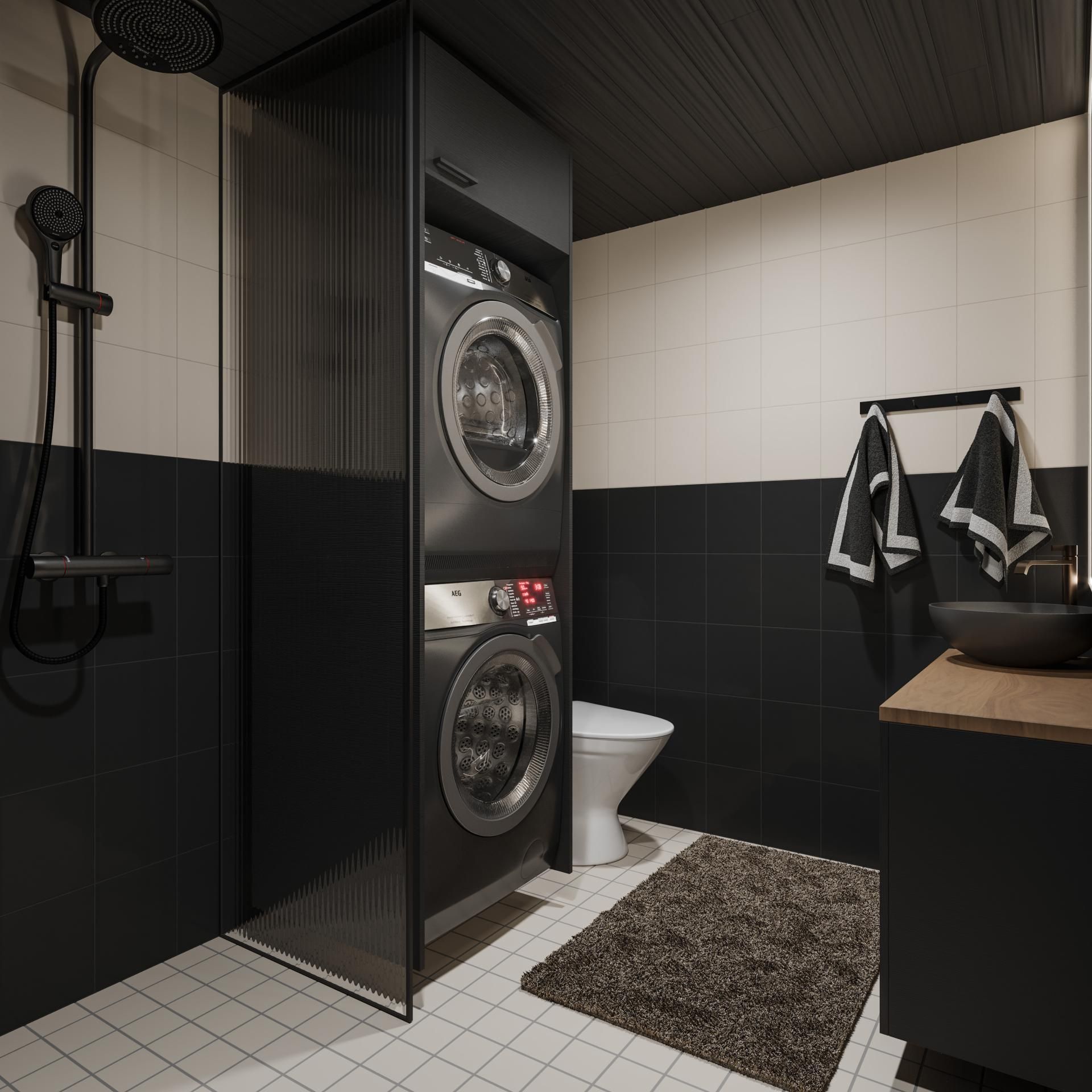 Ein modernes Badezimmer mit integrierter Waschmaschine und Trockner, Toilette und Waschbecken.