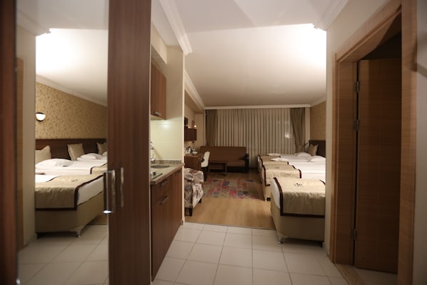 Standard Triple Room | In-room safe, desk, laptop workspace, blackout drapes