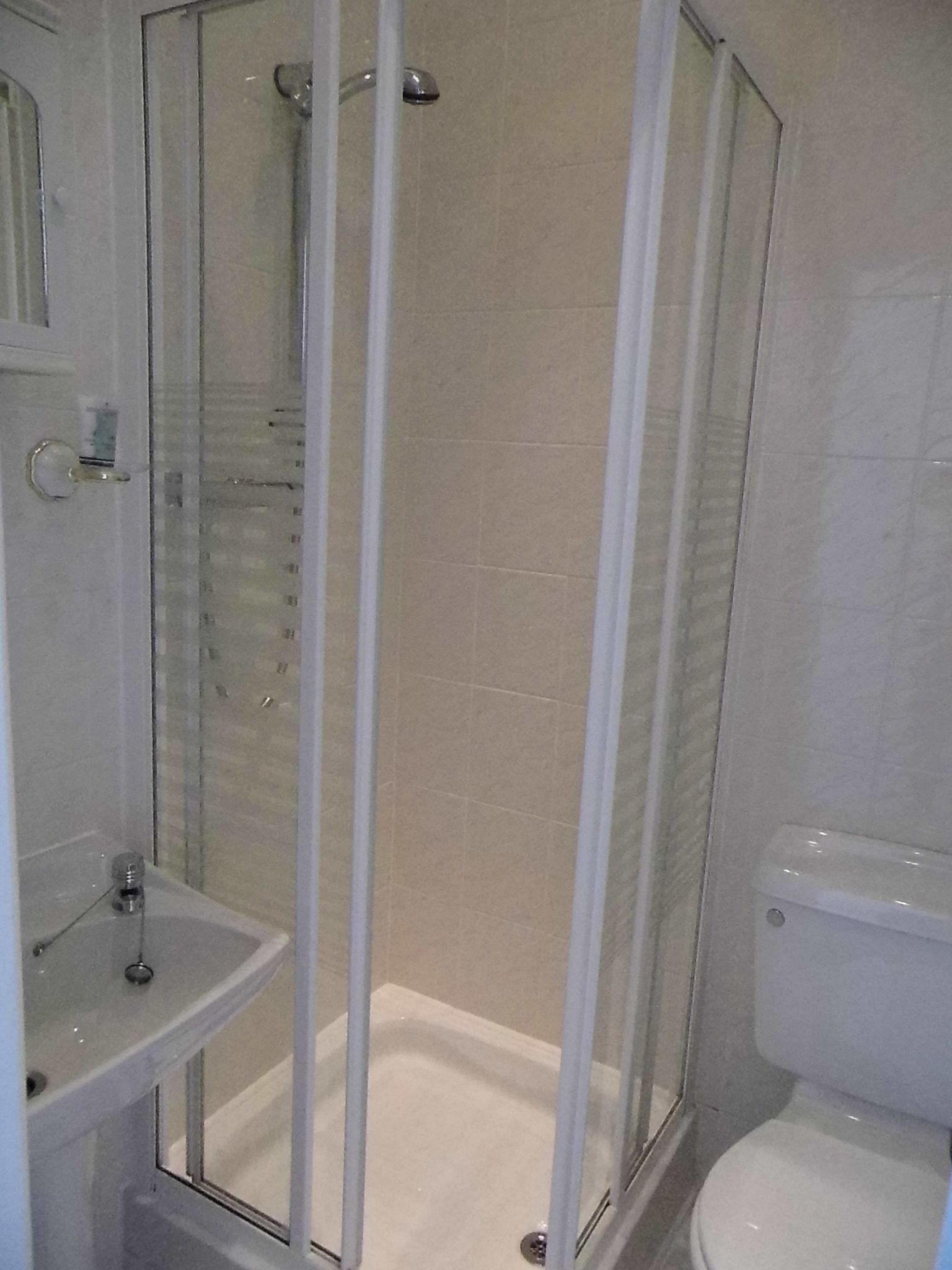 standard single room | bathroom | shower, free toiletries, hair dryer, towels