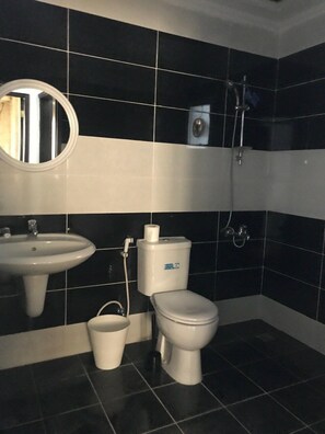 Comfort Apartment, City View | Bathroom | Shower, free toiletries, slippers, towels - Flowers INN 1 (Salmiya)