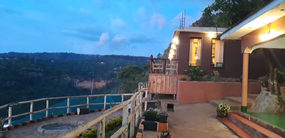 A building with a balcony overlooking a scenic landscape.