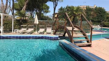 Indoor pool, outdoor pool, open 8:30 AM to 7:30 PM, pool umbrellas