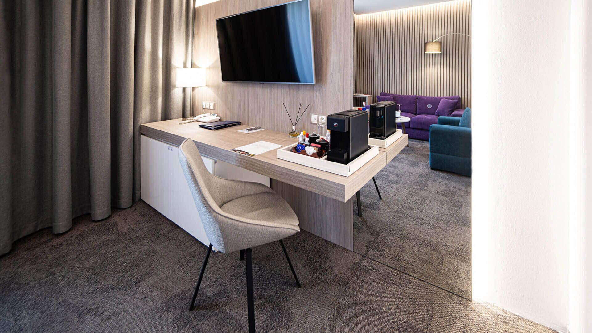 superior suite | living area | 125-cm flat-screen tv with satellite channels, tv, tablet