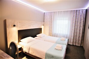 Standard Twin Room | Desk, blackout drapes, iron/ironing board, free WiFi