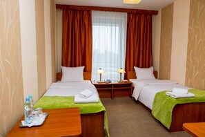 Standard Twin Room | Desk, blackout drapes, iron/ironing board, free WiFi