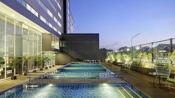 2 outdoor pools, open 6:00 AM to 9:00 PM, pool umbrellas, pool loungers