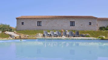 Seasonal outdoor pool, pool loungers