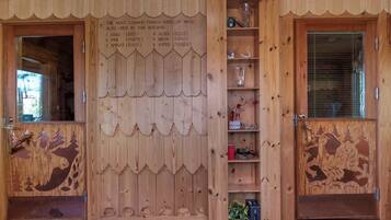 A wooden interior with a list of common Finnish woods used in the building.