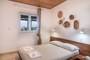 Apartment, Partial Sea View | Individually decorated, individually furnished, blackout drapes