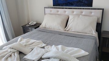 Minibar, iron/ironing board (on request), WiFi (free), bed sheets