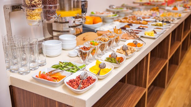 A buffet with various food items and drinks. - City Park Hotel Baku (Baku)