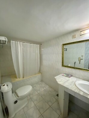 Deluxe Triple Room | Bathroom | Shower, bathrobes, slippers, towels - Quality Inn (Dhaka)