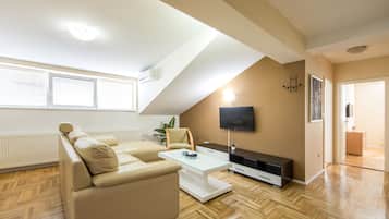 Premium Apartment | Living area | Flat-screen TV