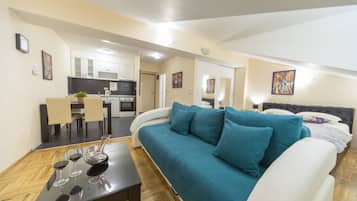Superior Studio | Living area | Flat-screen TV