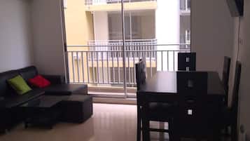 Comfort Apartment, 3 Bedrooms, Pool Access | Living area | 40-inch flat-screen TV with cable channels, TV