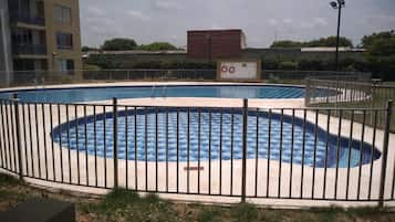 Outdoor pool, open 10:00 AM to 6:00 PM, pool umbrellas, pool loungers