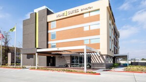 A modern hotel building with a sign reading "Home2 Suites by Hiltonton." - Home2 Suites by Hilton Houston IAH Airport Beltway 8 (Houston)