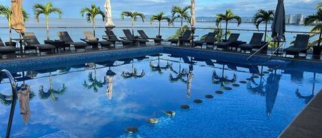Outdoor pool, open 9:00 AM to 9:00 PM, pool umbrellas, sun loungers