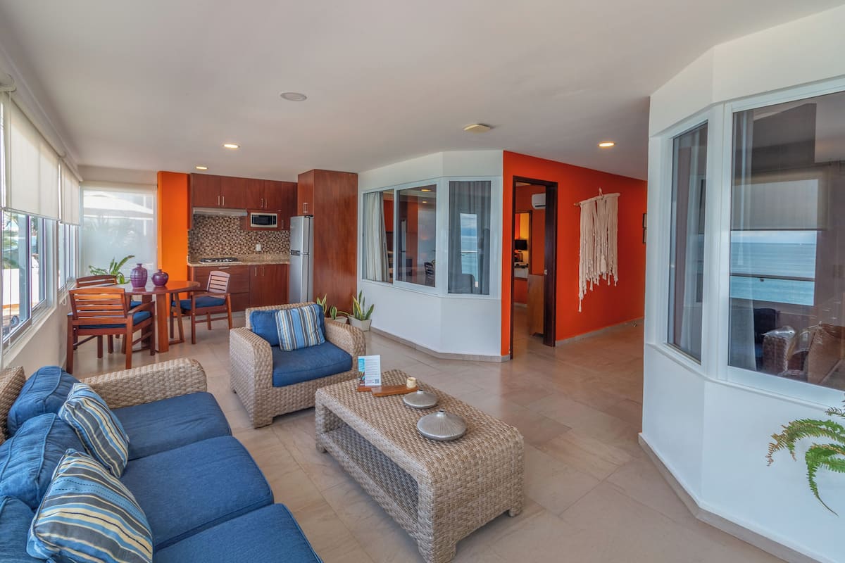 grand penthouse, multiple beds, private pool, beachfront | living area | 40-inch smart tv with cable channels, tv