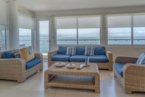 Exclusive Penthouse 1 - Casa Don Martín with ocean view with private plunge pool | Living area | 40-inch Smart TV with cable channels, TV - The Paramar Beachfront Boutique Hotel - Downtown Malecon (Puerto Vallarta)