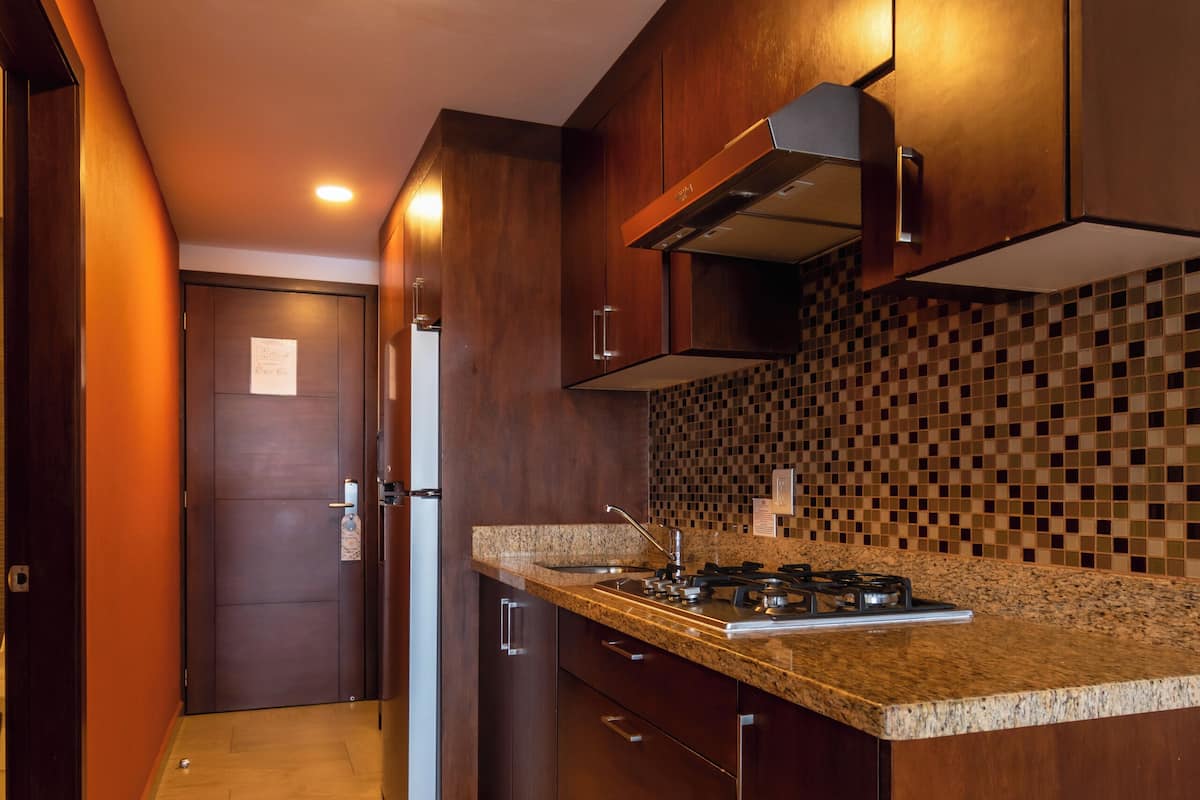 grand studio suite, multiple beds, balcony, beachfront | private kitchen | microwave, stovetop, coffee/tea maker, toaster