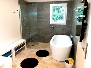 Bathtub, hair dryer, towels, soap