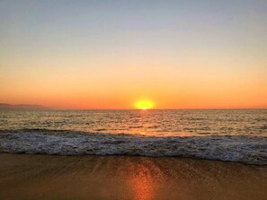 On the beach, sun-loungers, beach towels