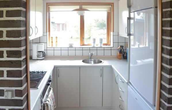 Fridge, stovetop, dishwasher, coffee/tea maker