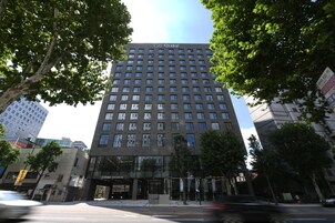 A multi-story building with a prominent sign at the top.