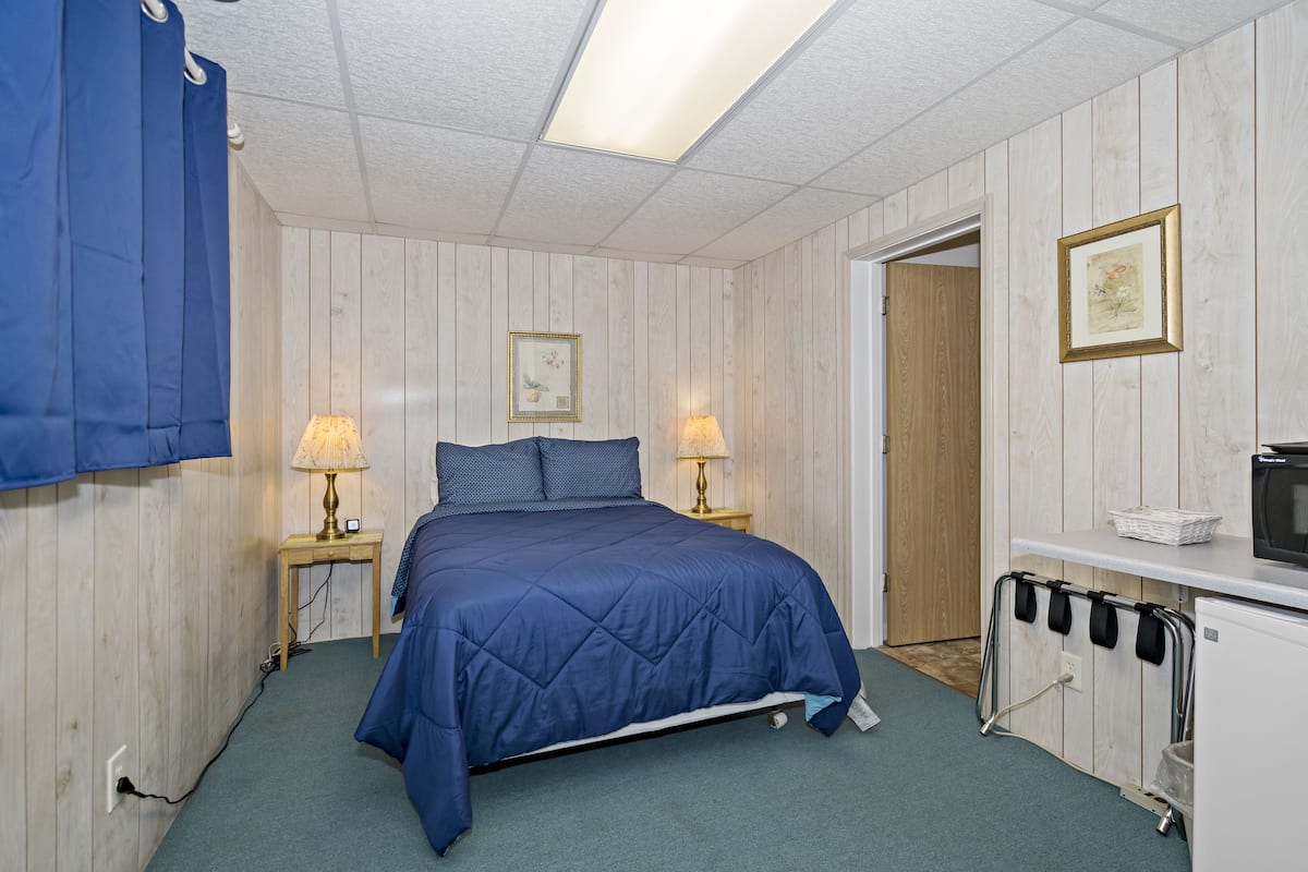 Desk, laptop workspace, blackout curtains, free WiFi