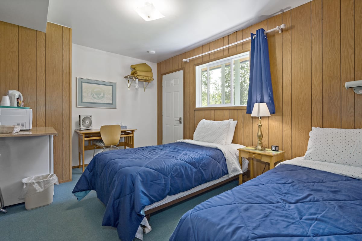 Desk, laptop workspace, blackout curtains, free WiFi