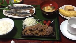 A table with various dishes including fish, rice, and vegetables. - Hidejiro (Fukuchiyama)